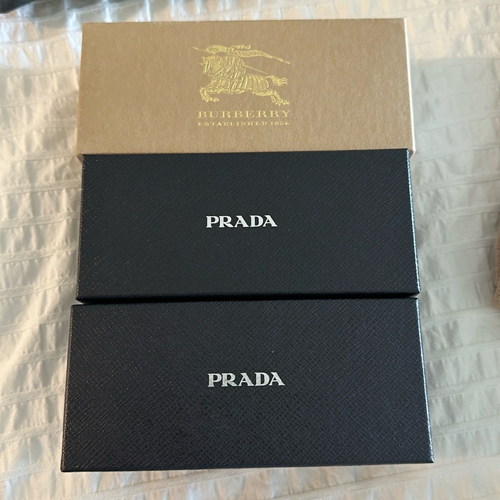 Prada and Burberry sunglass boxes